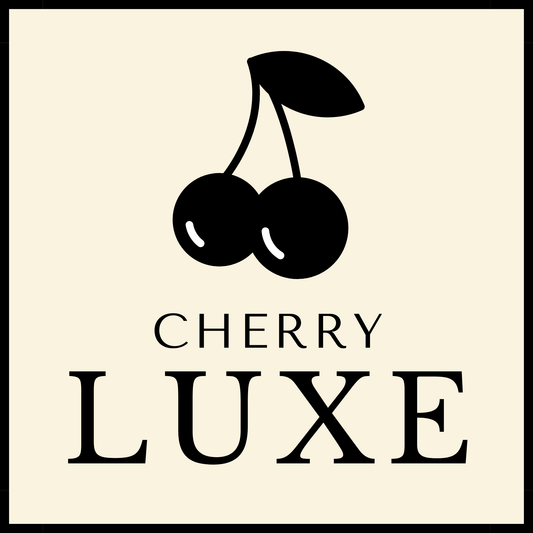 Logo of Cherry Luxe with black cherries and text on a beige background