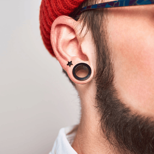 Flat star ear cartilage piercing bar worn