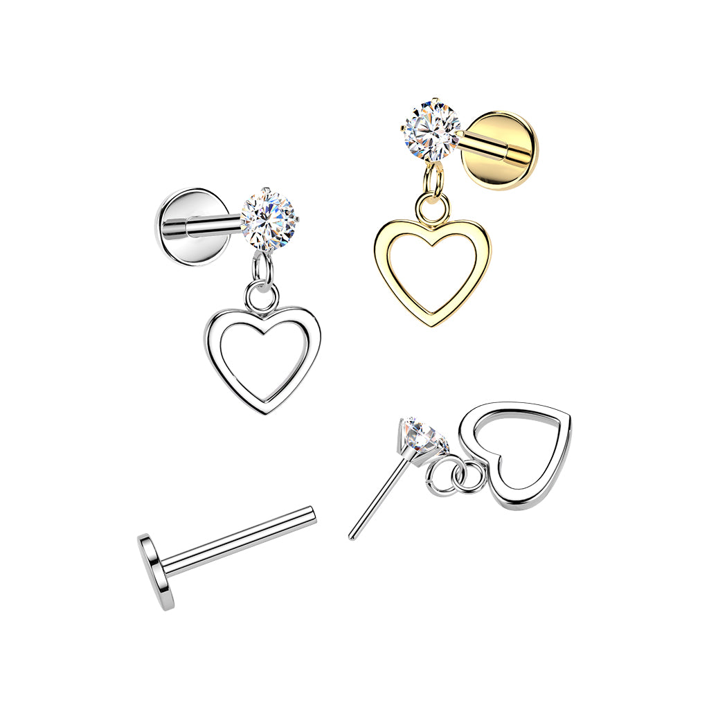 Set of heart-shaped earrings in gold, silver, and clear crystal on a white background