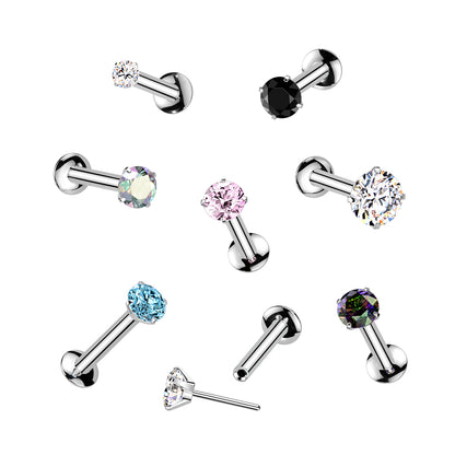 Set of multiple flat back labret earrings with colored gemstones on a white background