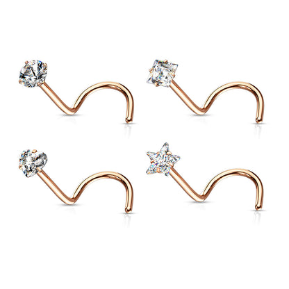 Set of rose gold nose rings with clear gemstones on a white background
