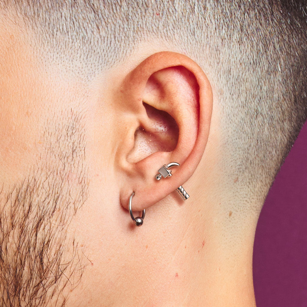 Silver hammer ear cartilage piercing bar worn