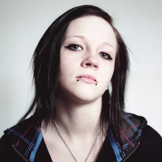 black circular lip ring